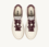 Zapatillas bajas Medallist en piel higo y plateada.